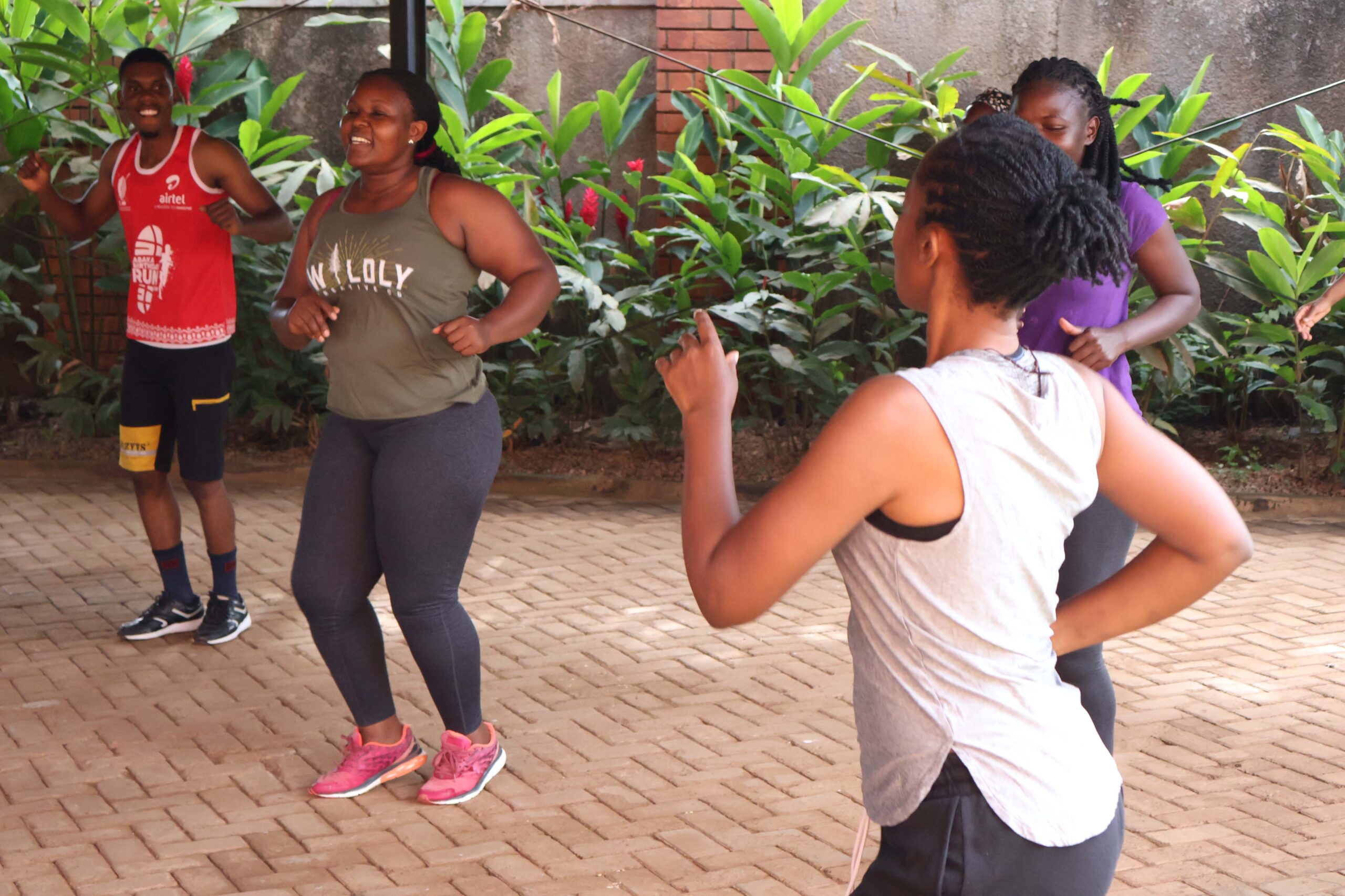 Feel the rhythm! Smiles and sweat as the group dives into some upbeat aerobic exercises